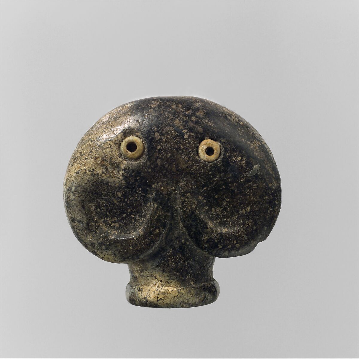 Amulet in the form of a head of an elephant, Serpentinite, bone