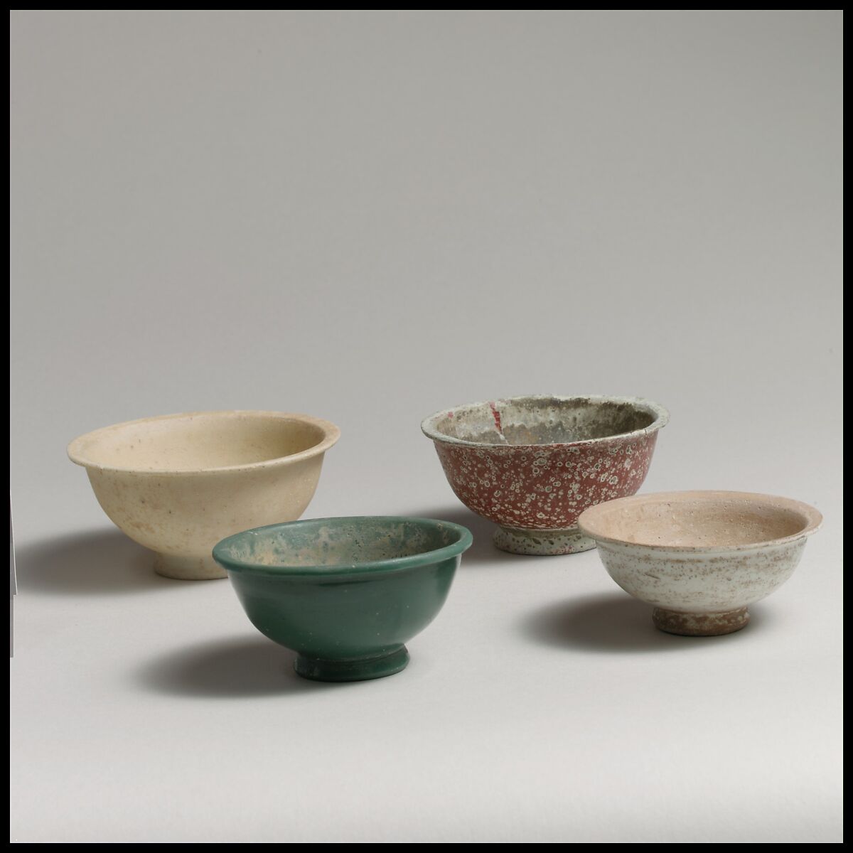 Four monochrome bowls, glass, Roman, Syrian